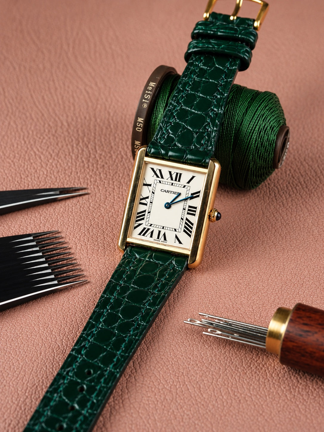 Green alligator strap on a Cartier Tank
