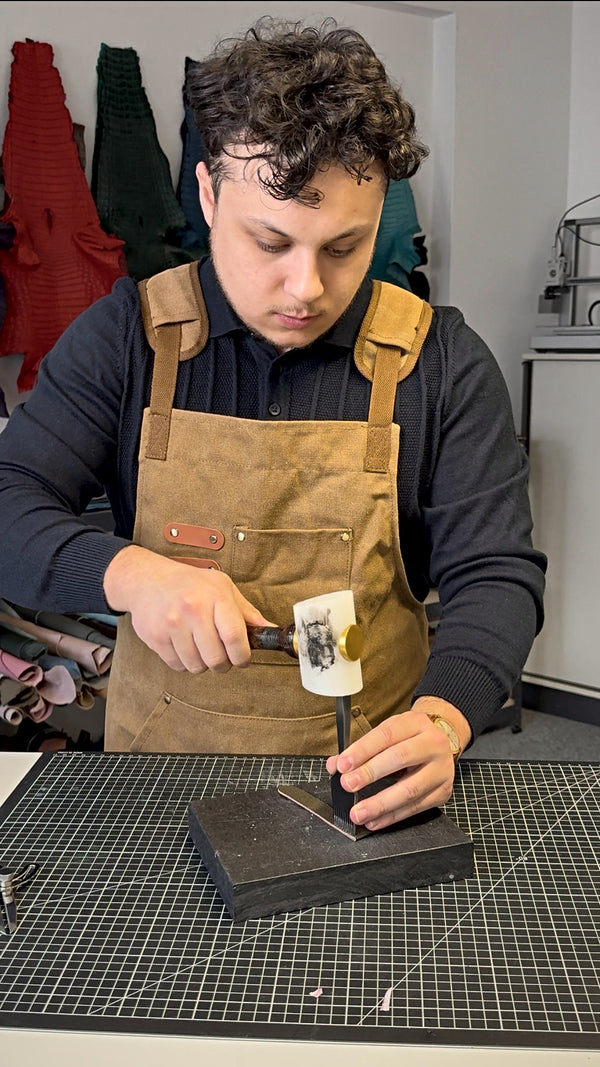 Punching stitch holes in a strap with a mallet